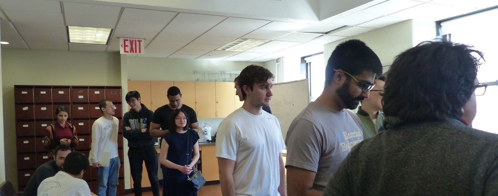 Graduate electrical engineering students lining up for lunch during a mid-semester get-together