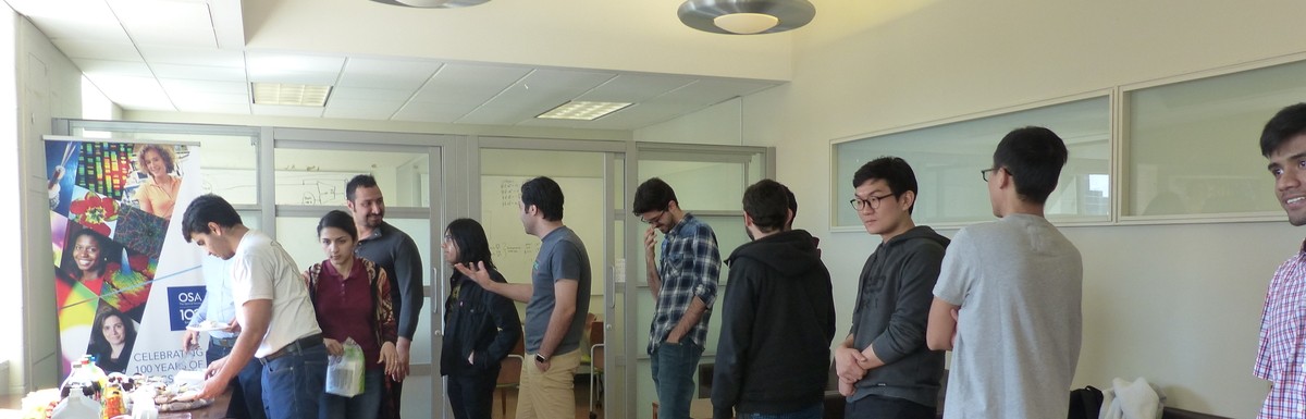 Graduate electrical engineering students lining up for lunch during a mid-semester get-together