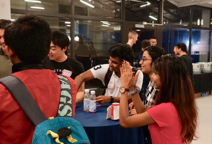 Graduate electrical engineering students engaging in ice breakers during the kick-off event